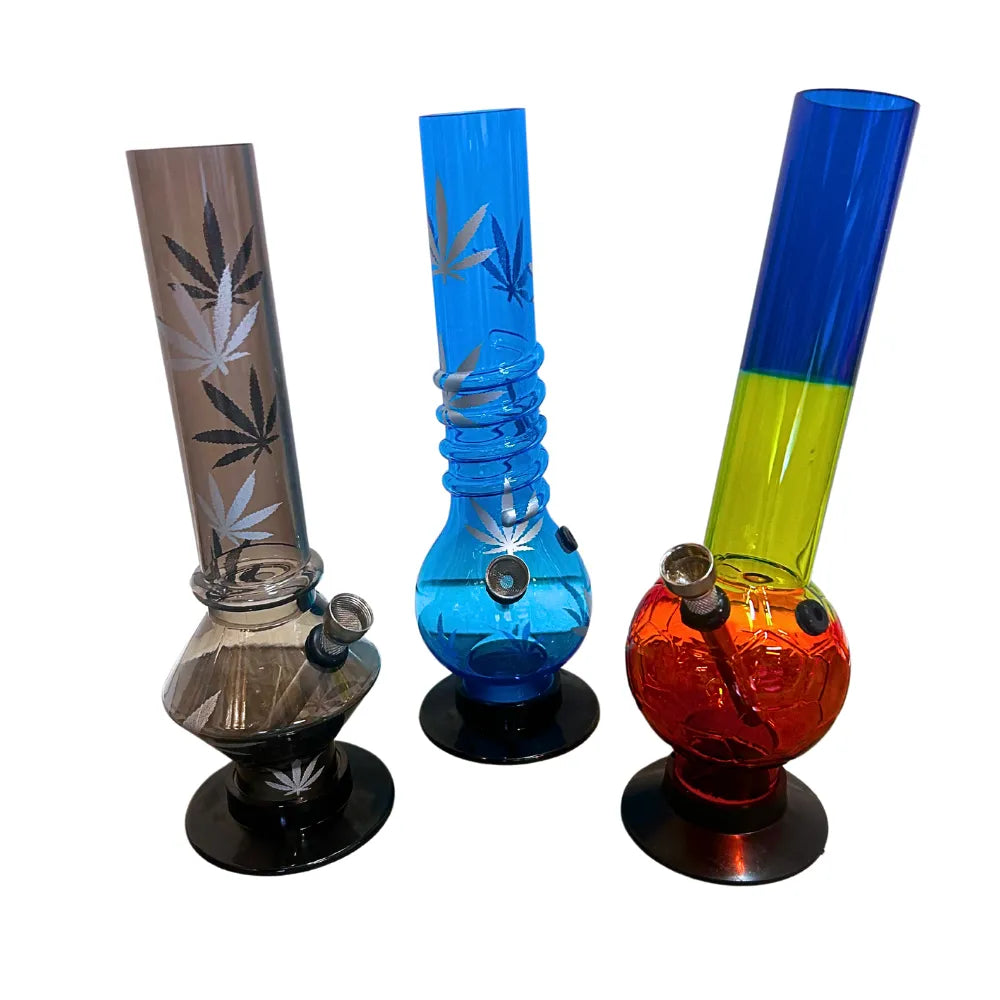 Three acrylic smoking devices with leaf designs on a white background
