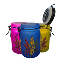 Three colourful glass jars with cannabis leaf designs on a white background