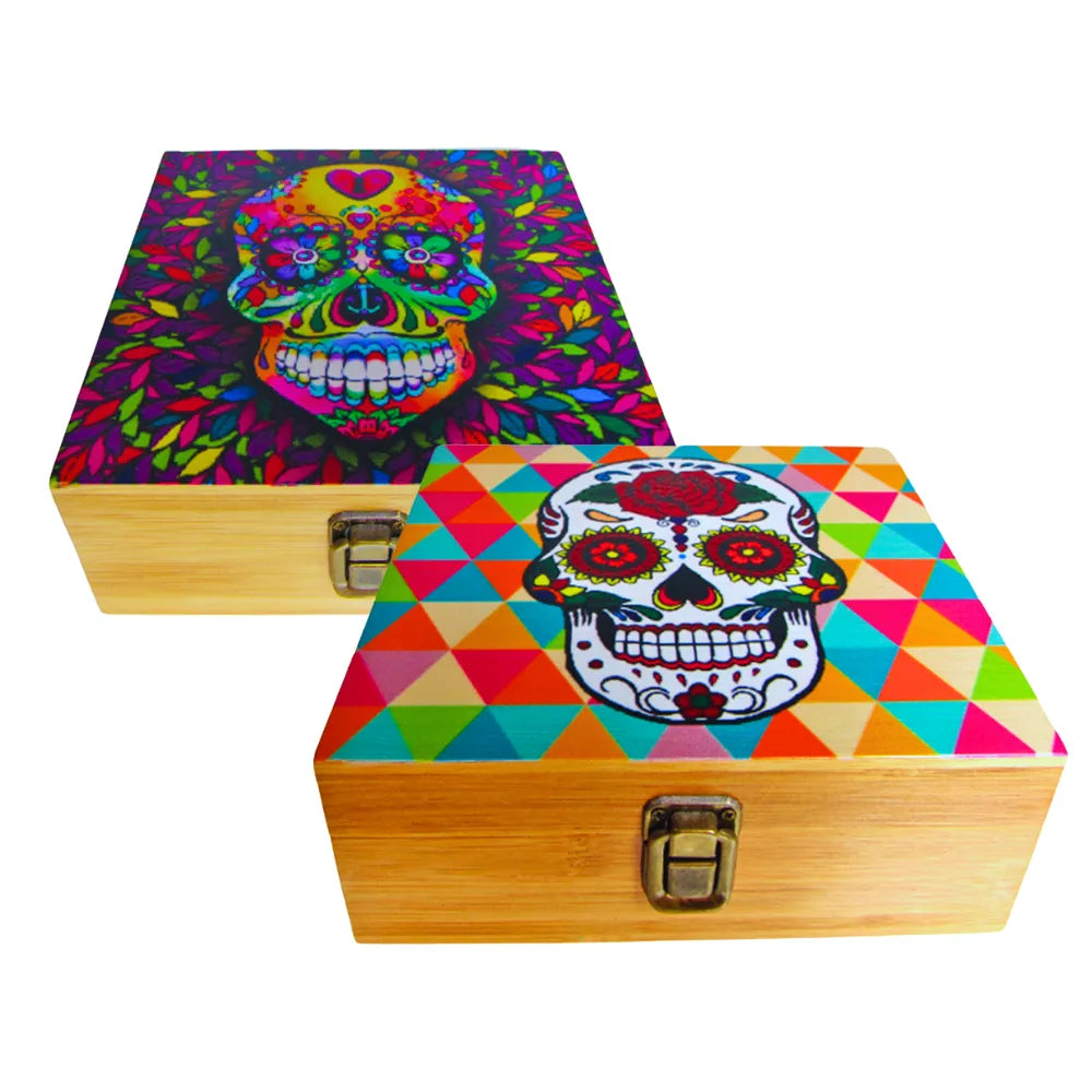 Two wooden boxes with colourful skull designs on lids against a white background