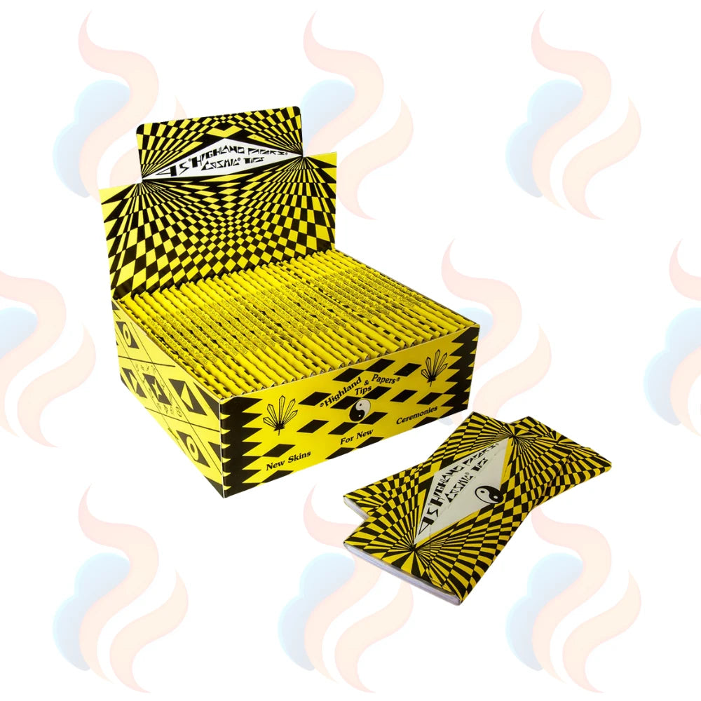 Yellow and Black Highland cosmic rolling papers on a white background