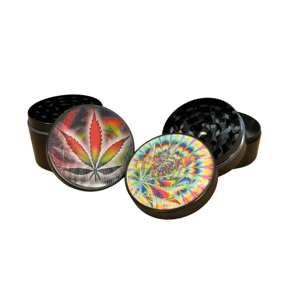 Black "Holographic Leaf" herb grinders with colourful designs on a white background