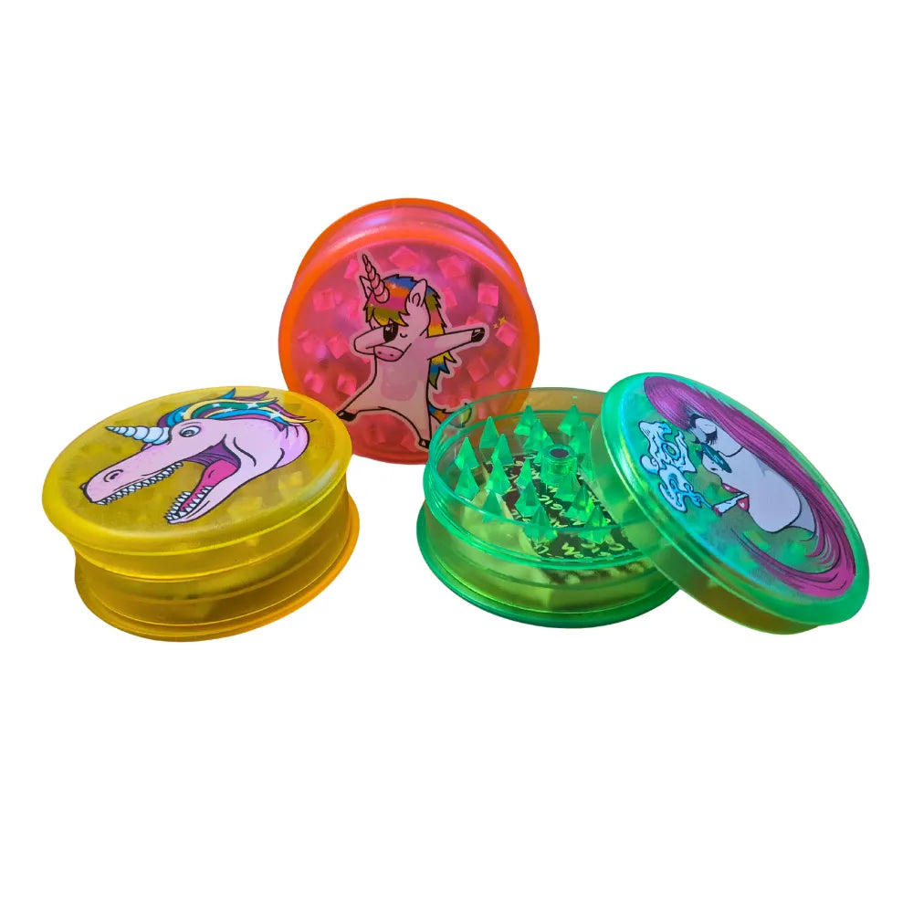 Three colourful Magic Leaf "Print-Collection" plastic grinders with unicorn inspired designs.