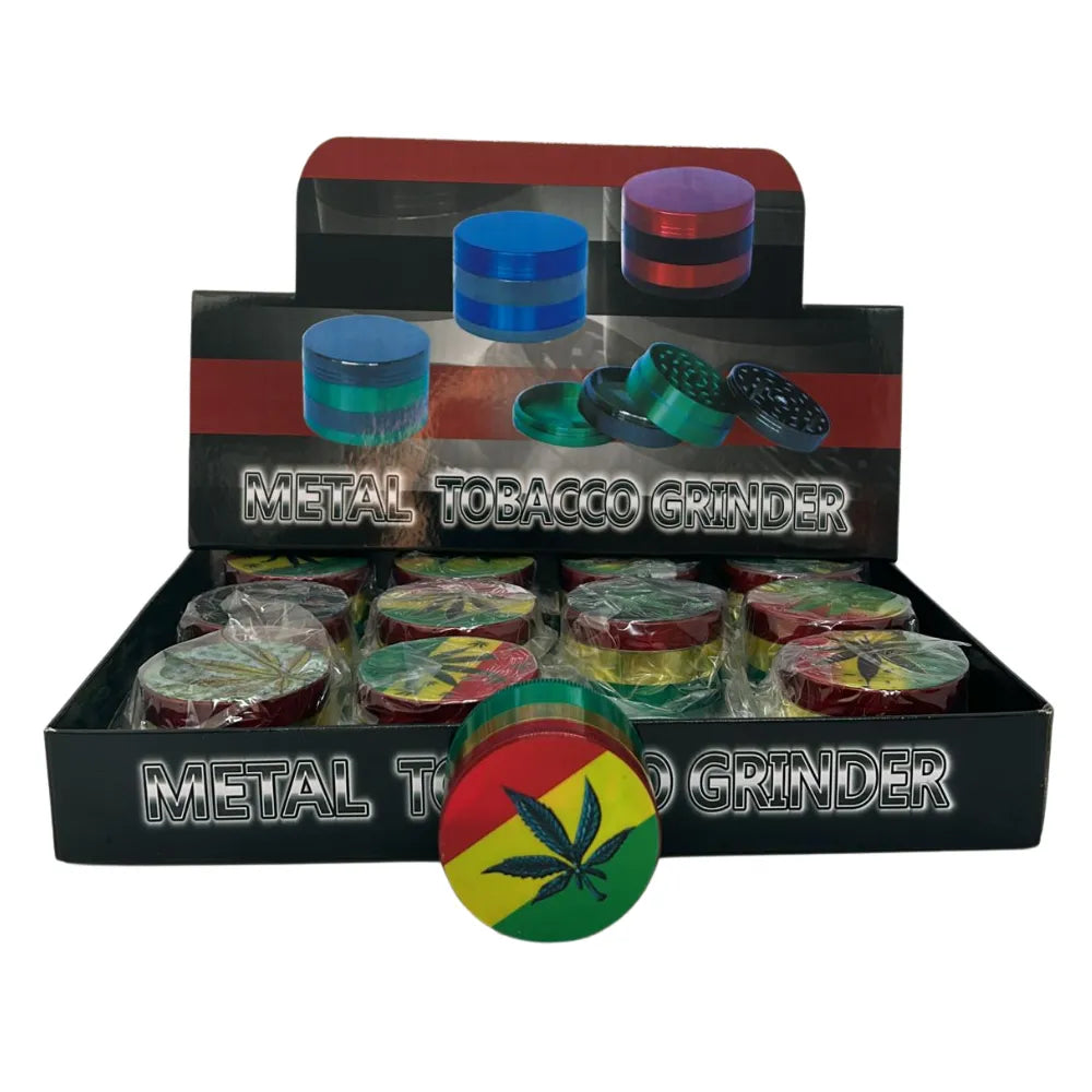 Metal tobacco grinders with colourful reggae design on a display box