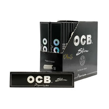 OCB slim rolling paper packaging including 50 packs on a white background