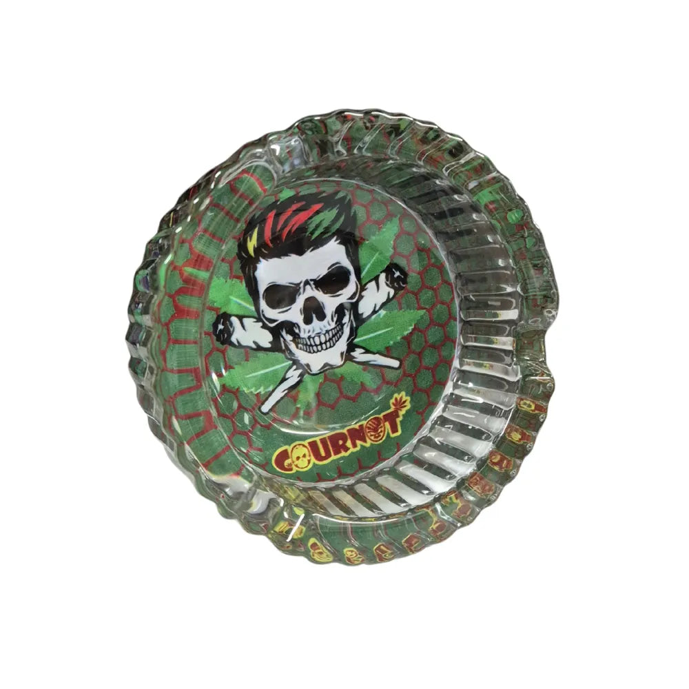 Transparent green glass ashtray with a printed skull design and 'COURNOT' branding on a white background