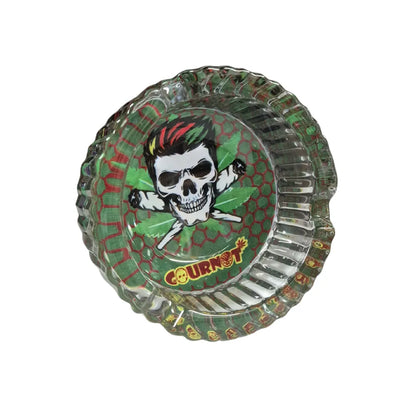 Transparent green glass ashtray with a printed skull design and 'COURNOT' branding on a white background