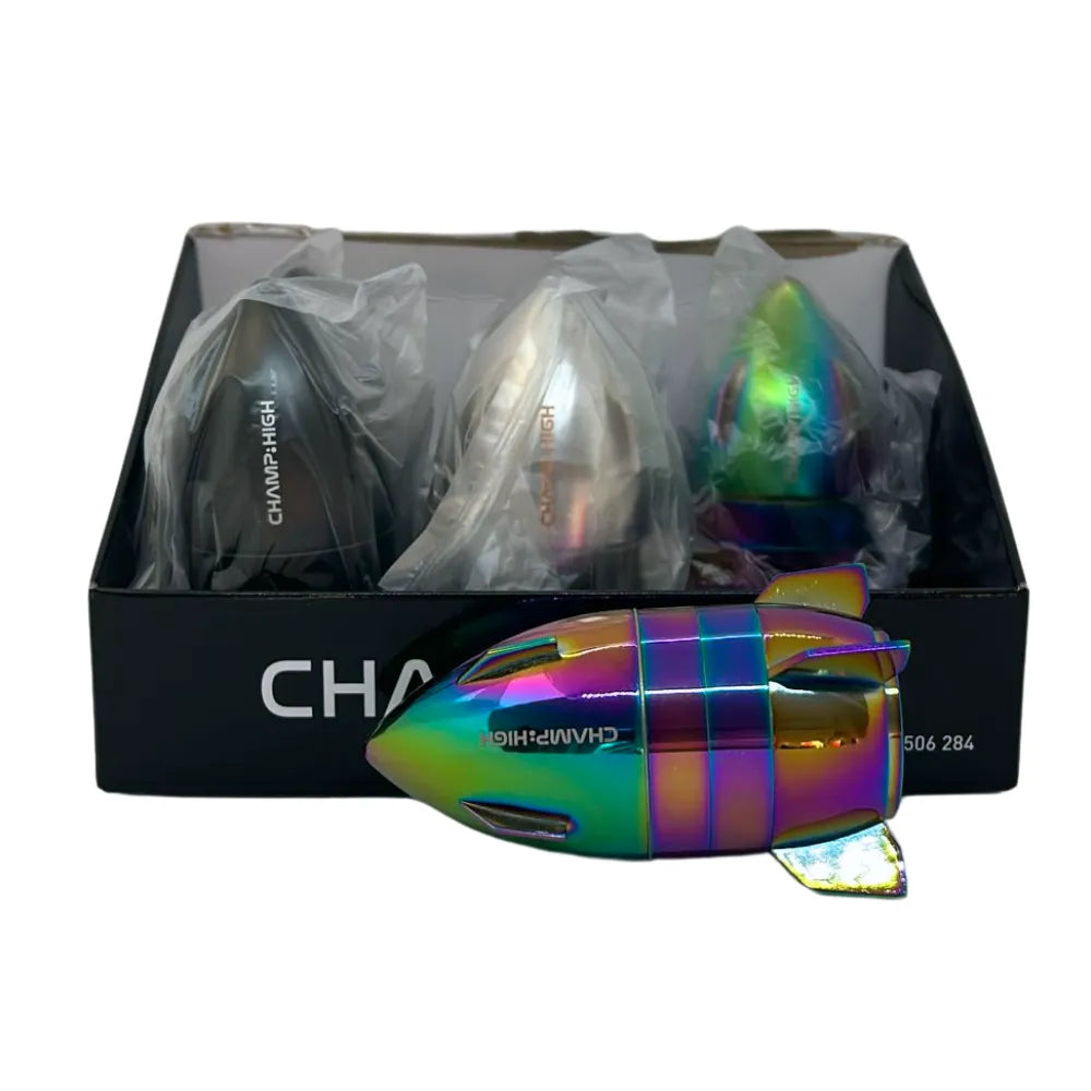 colourful rocket shaped grinder in front of packaging for a box of 6 grinders