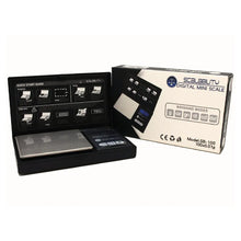 Digital mini scale with packaging on a white background