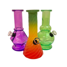 Three colourful glass bongs on a white background