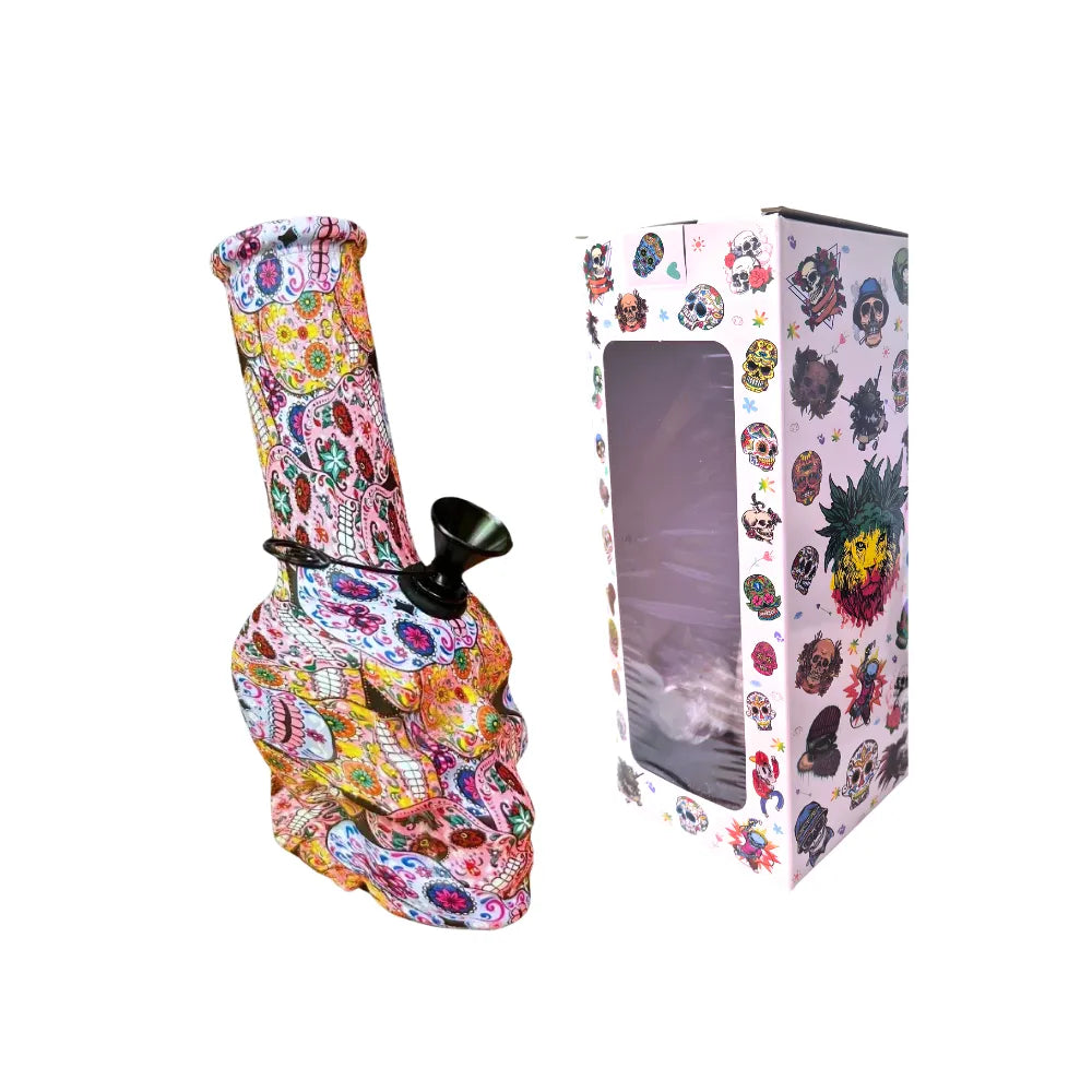 Small colourful skull-patterned bong with packaging on a white background