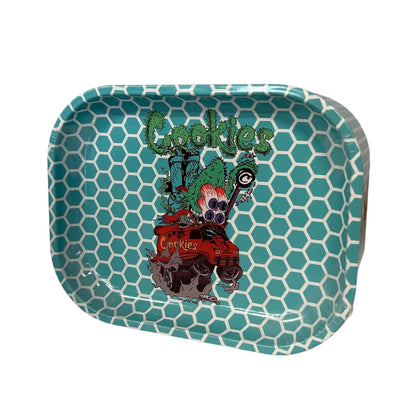 Teal storage tin with 'Cookies' branding and graphics on a white background