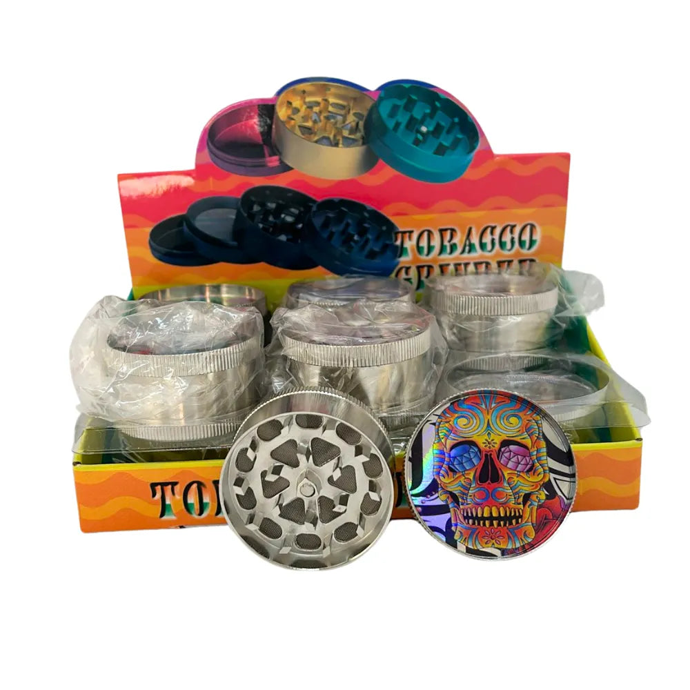 Tobacco grinders with colorful skull design on a display box.