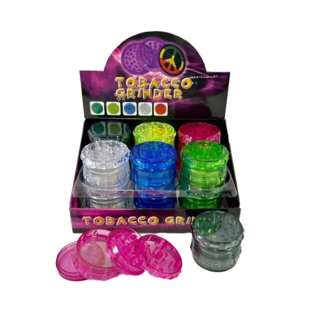 Display of colourful plastic tobacco grinders on a white background