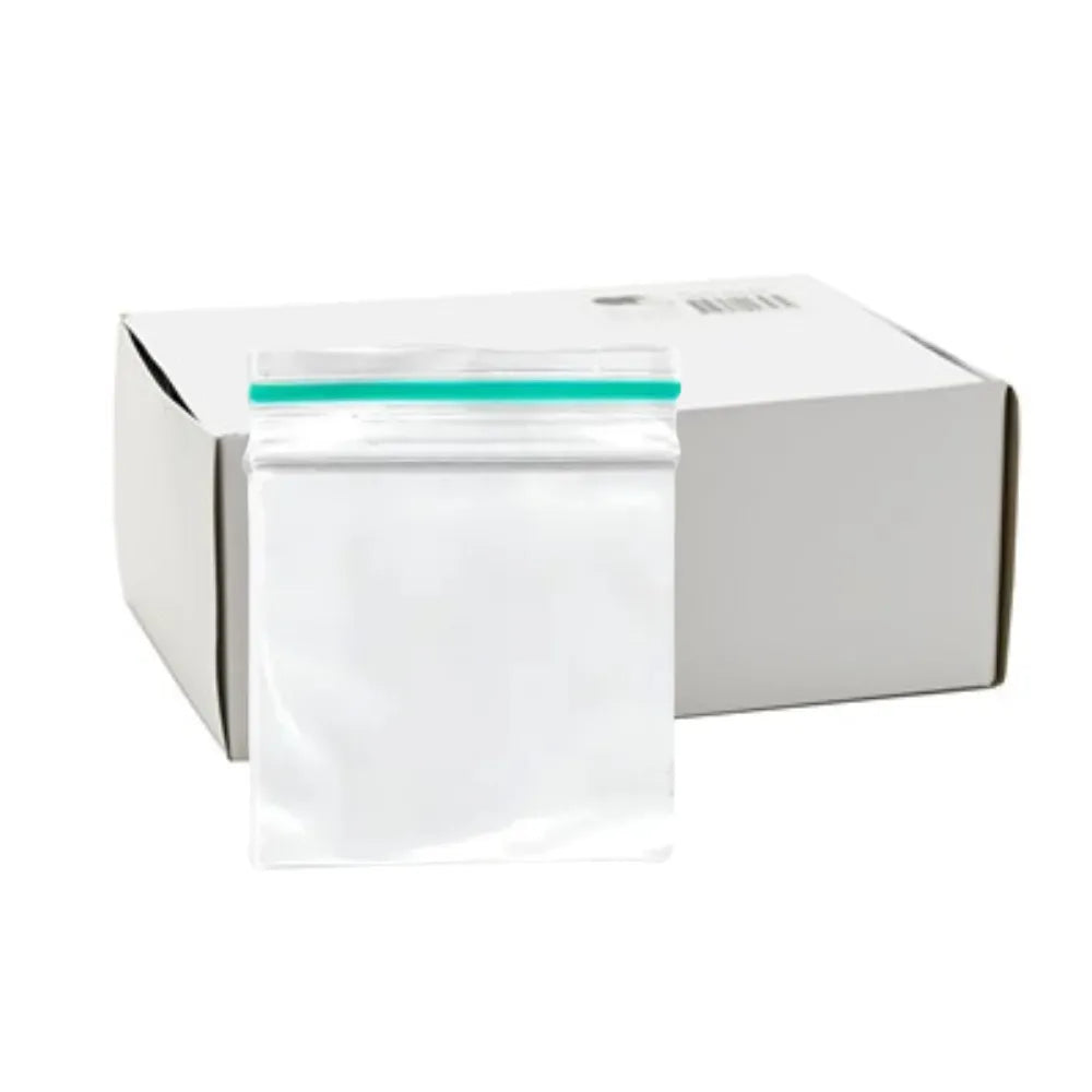White box with a little clear plastic bag with a green strip on a white background