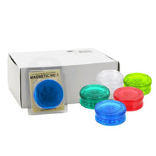 Set of colourful magnetic plastic grinders with a box labelled 'Magnetic No.1' on a white background